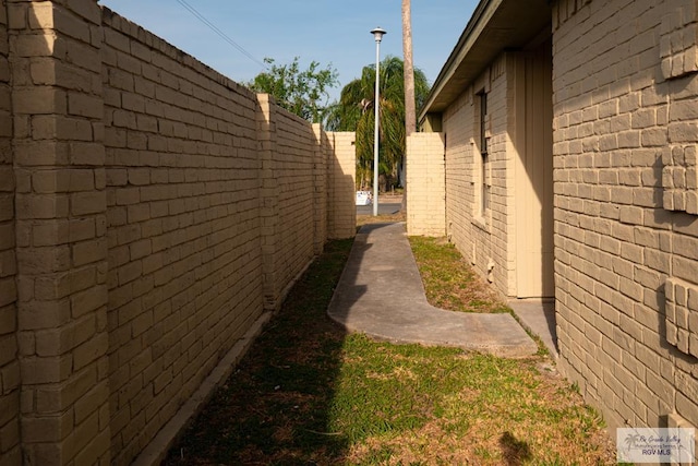 view of side of property with fence