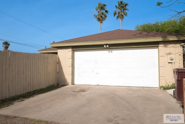 garage featuring fence