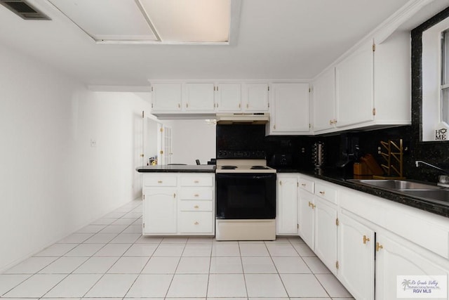 kitchen featuring backsplash, electric stove, sink, and white cabinets