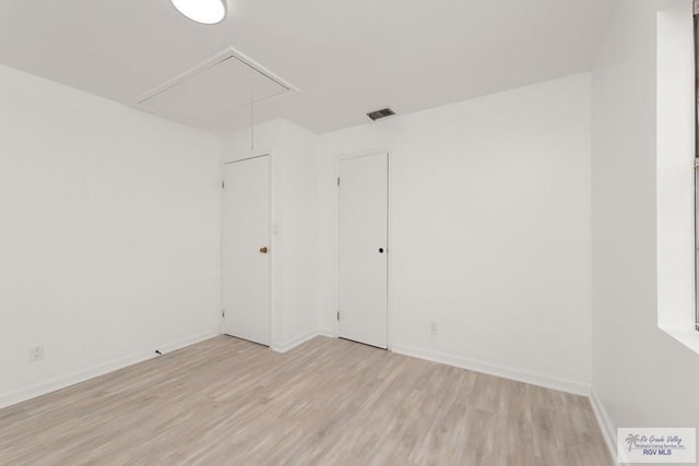 unfurnished room with light hardwood / wood-style floors