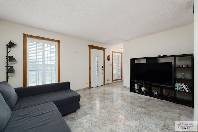 living room featuring a textured ceiling