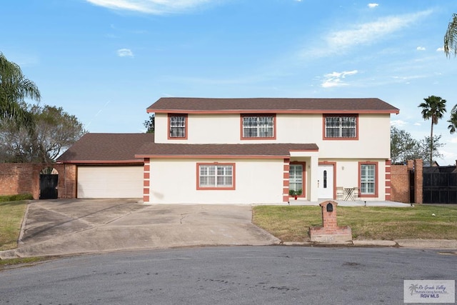 view of front facade with a front lawn and a garage