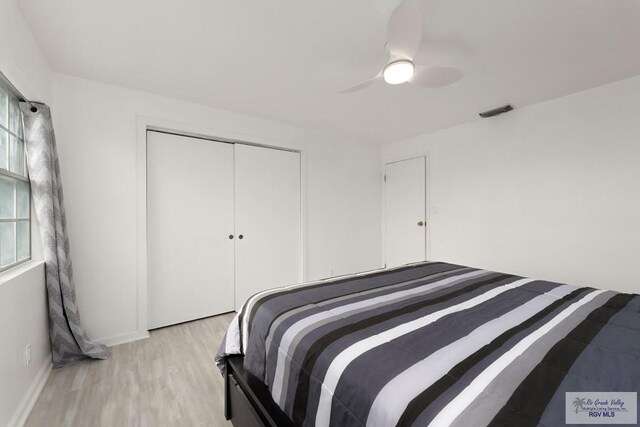 bedroom featuring a closet, ceiling fan, and light hardwood / wood-style floors