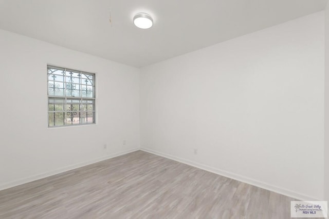 unfurnished room with light hardwood / wood-style flooring