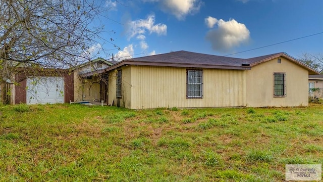 view of home's exterior with a lawn