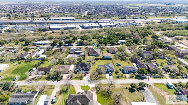 birds eye view of property with a residential view