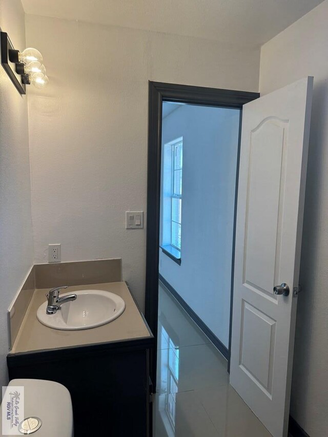14 Bahia Cir, Brownsville, TX 78521 - bathroom featuring vanity and tile patterned flooring