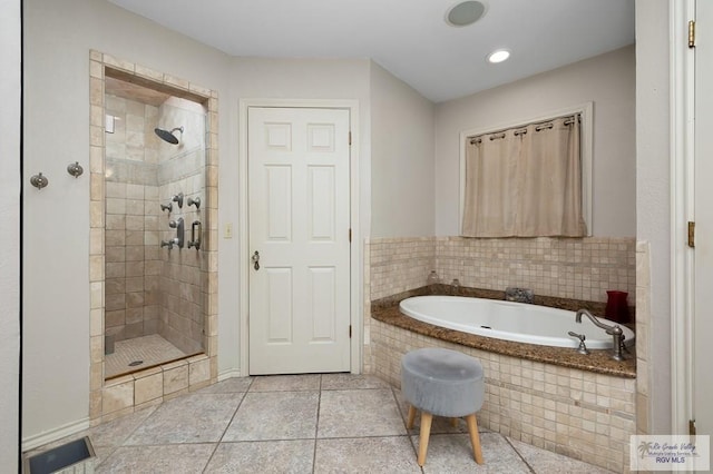 bathroom featuring tile patterned floors and plus walk in shower