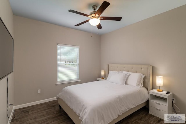 bedroom with dark hardwood / wood-style floors and ceiling fan