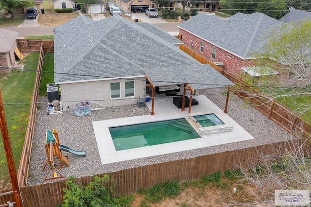 view of pool featuring cooling unit, a patio area, and an in ground hot tub