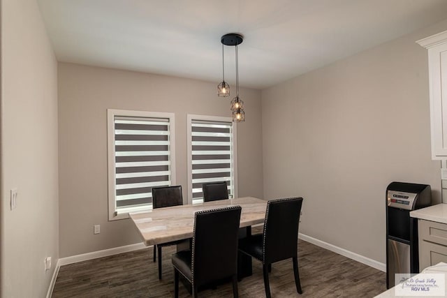 dining room with dark wood-type flooring