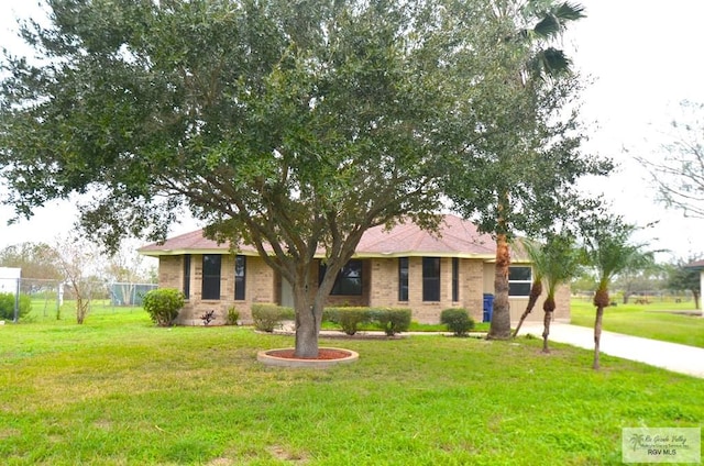 ranch-style house with a front yard