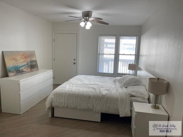 bedroom featuring ceiling fan and wood-type flooring