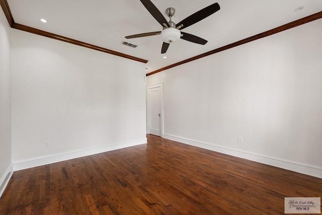 empty room with visible vents, crown molding, ceiling fan, baseboards, and wood finished floors