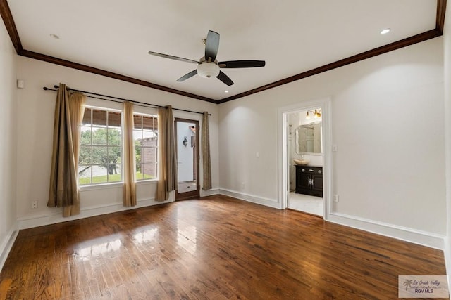 unfurnished room with crown molding, wood finished floors, baseboards, and ceiling fan