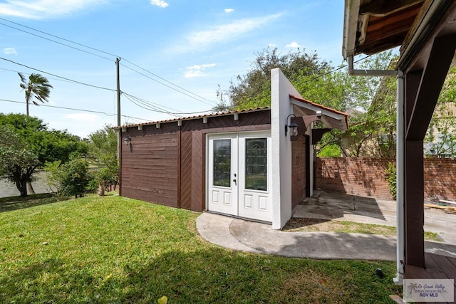 view of outbuilding featuring an outbuilding and fence