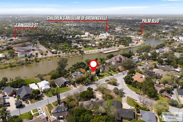 bird's eye view featuring a water view and a residential view