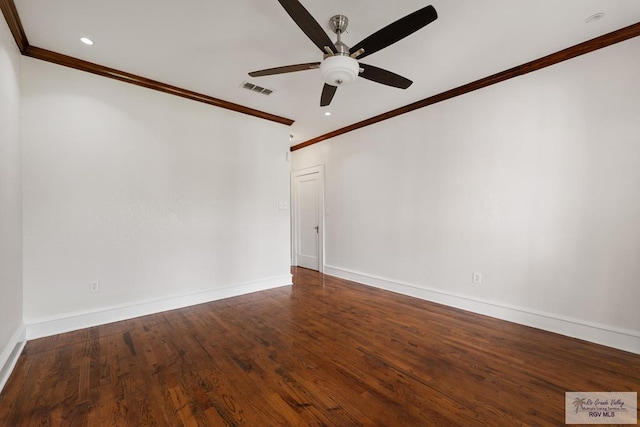 unfurnished room with wood finished floors, baseboards, visible vents, ceiling fan, and ornamental molding