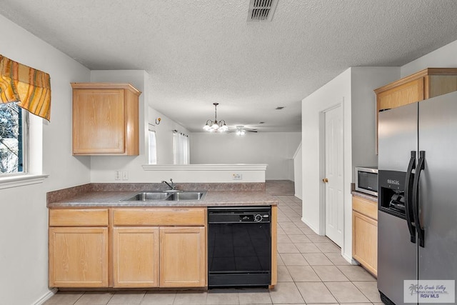 kitchen featuring light brown cabinets, sink, light tile patterned floors, a textured ceiling, and appliances with stainless steel finishes