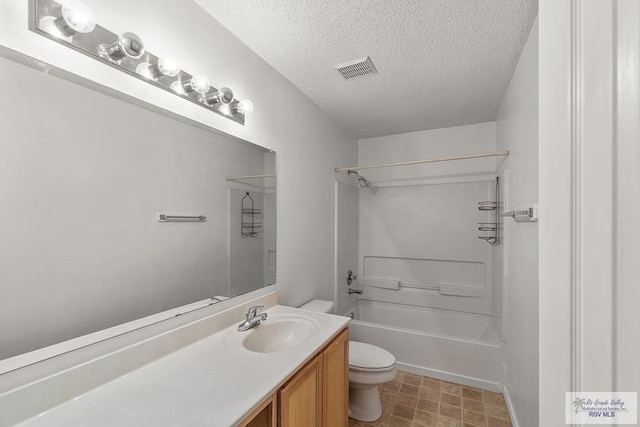 full bathroom with vanity, shower / bathing tub combination, a textured ceiling, and toilet