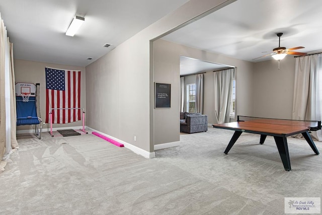 recreation room featuring ceiling fan and light carpet