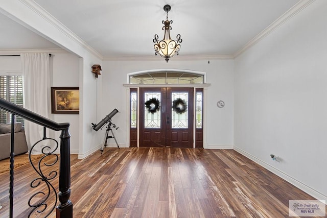 entryway featuring dark hardwood / wood-style flooring, french doors, and ornamental molding