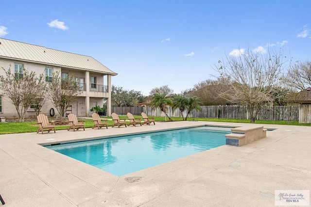 view of swimming pool featuring a patio