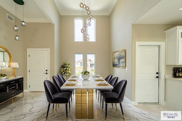 dining room with ornamental molding, marble finish floor, visible vents, and baseboards