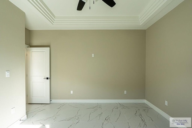 unfurnished room with marble finish floor, baseboards, a ceiling fan, and ornamental molding