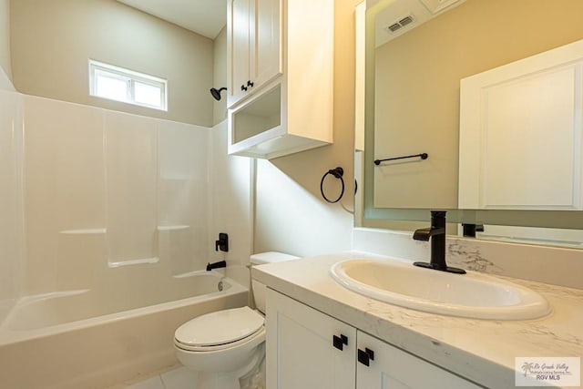 full bath featuring visible vents, bathing tub / shower combination, vanity, and toilet