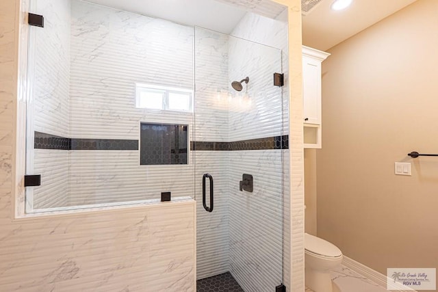 bathroom with toilet, recessed lighting, baseboards, marble finish floor, and a stall shower