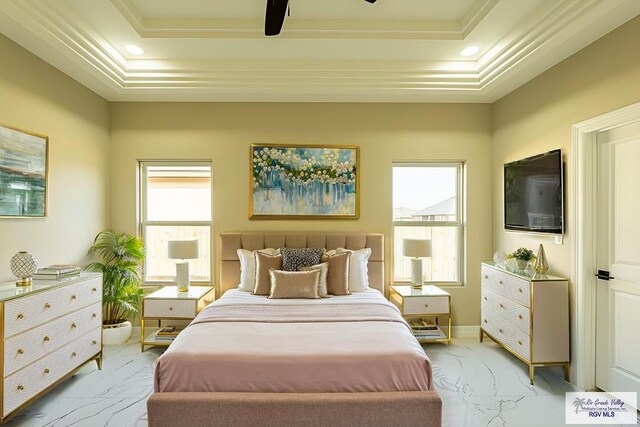 bedroom with recessed lighting, a raised ceiling, and marble finish floor