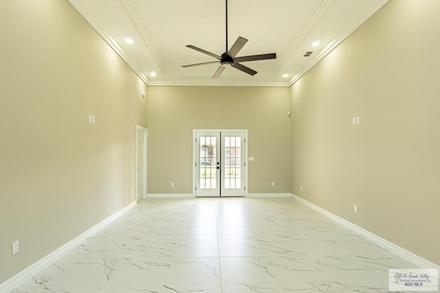 unfurnished room featuring marble finish floor, baseboards, crown molding, and french doors