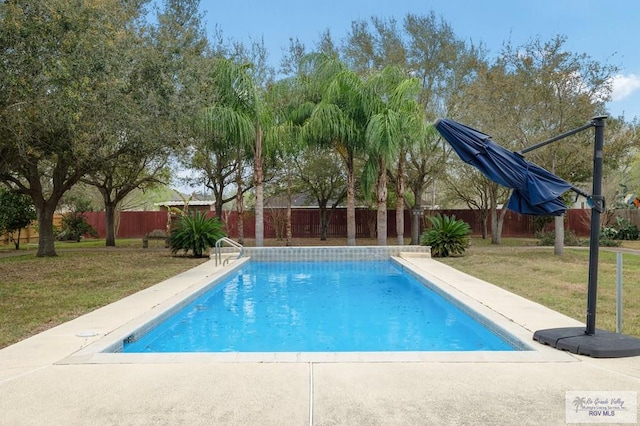 view of pool featuring a fenced in pool, a fenced backyard, and a yard