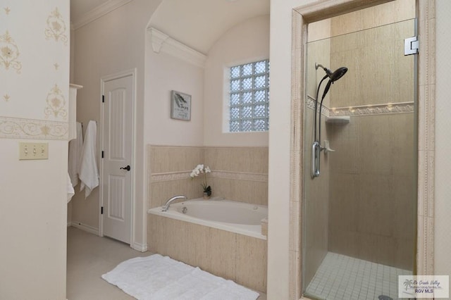 bathroom featuring crown molding, a shower stall, and a bath