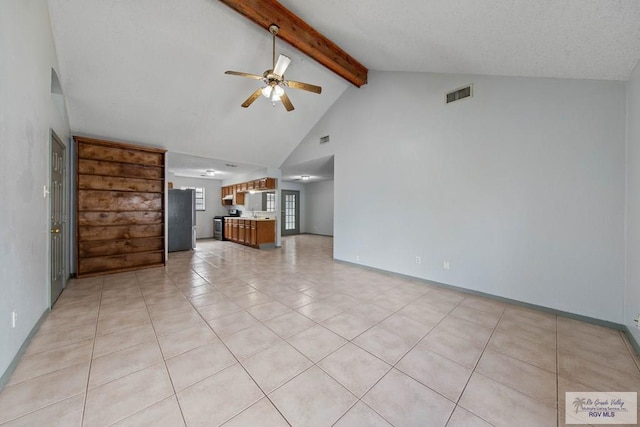 unfurnished living room featuring ceiling fan, beamed ceiling, light tile patterned flooring, and high vaulted ceiling