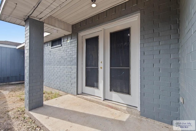 entrance to property with a patio