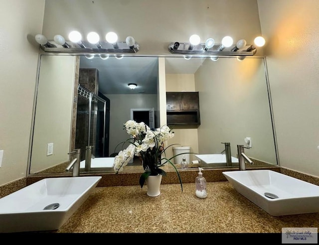 full bathroom with a sink and a tile shower