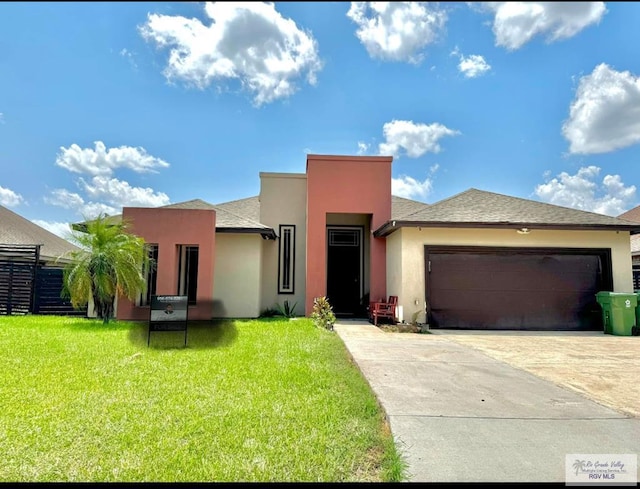 view of front facade featuring concrete driveway, a front lawn, an attached garage, fence, and stucco siding