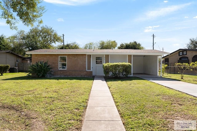 single story home with a front lawn, central AC unit, and a carport