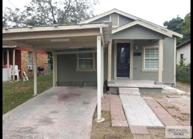 bungalow-style home with a carport