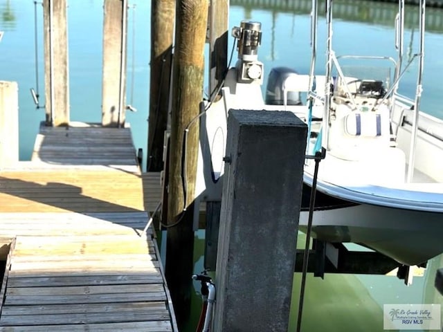 view of dock with a water view and boat lift