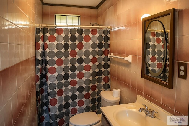 34719 Los Ranchos Rd Unit 1, San Benito, TX 78586 - full bathroom with tile walls, vanity, ornamental molding, and a shower with curtain