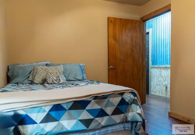 bedroom featuring hardwood / wood-style floors