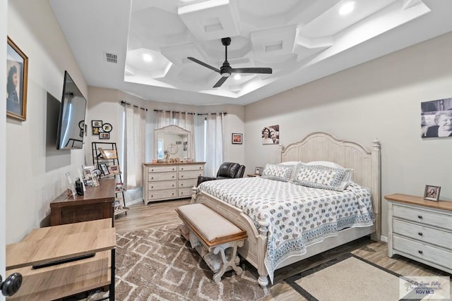 bedroom with hardwood / wood-style flooring, ceiling fan, and coffered ceiling