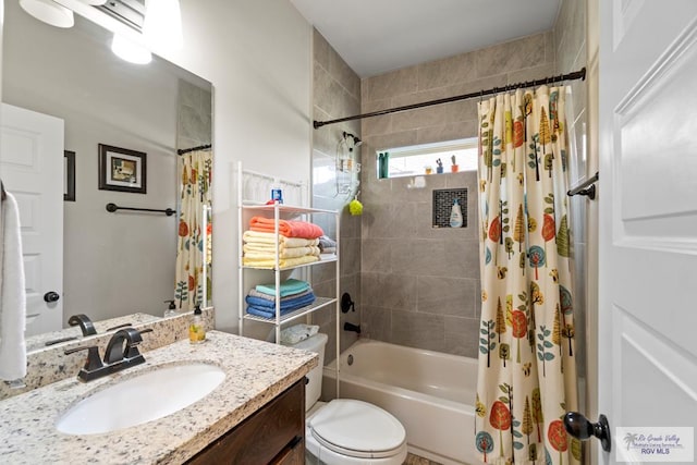 full bathroom featuring vanity, toilet, and shower / bathtub combination with curtain