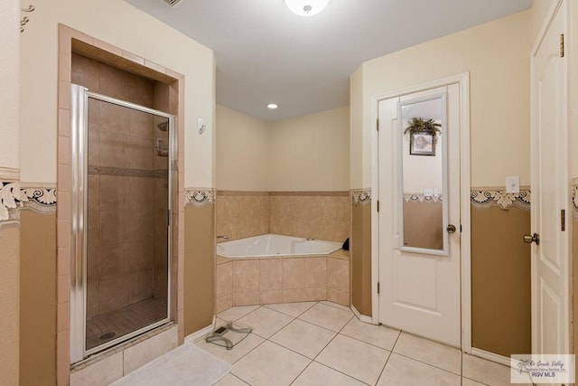 bathroom featuring tile patterned flooring and plus walk in shower