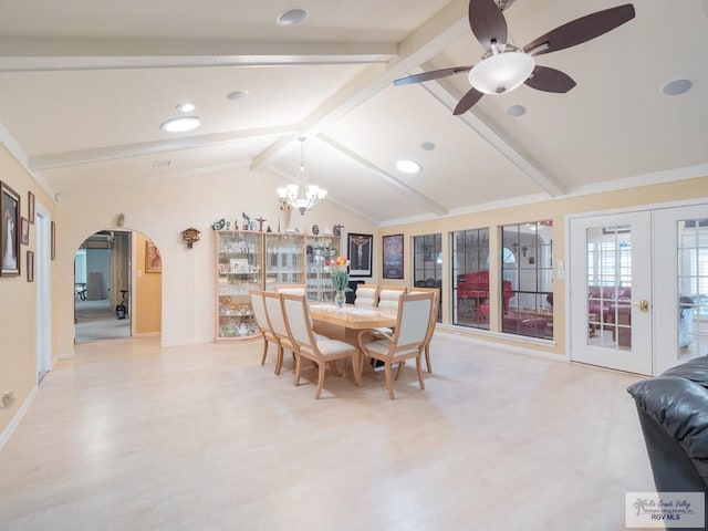 dining space with vaulted ceiling with beams, french doors, light hardwood / wood-style floors, and ceiling fan with notable chandelier