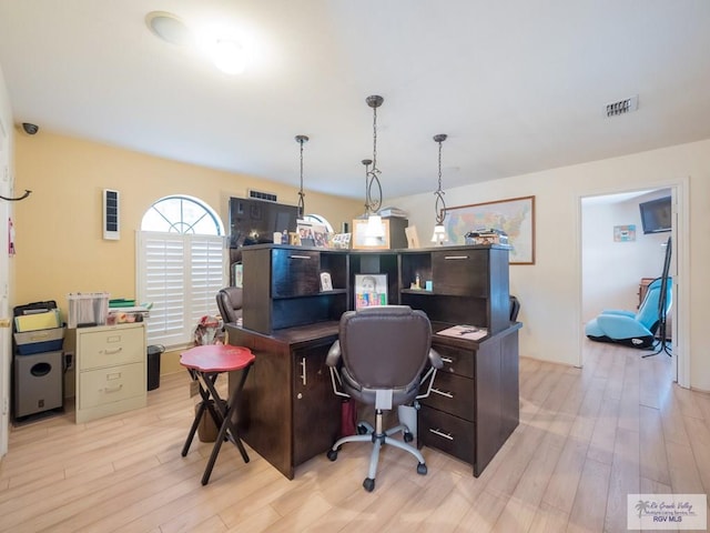 home office featuring light hardwood / wood-style floors