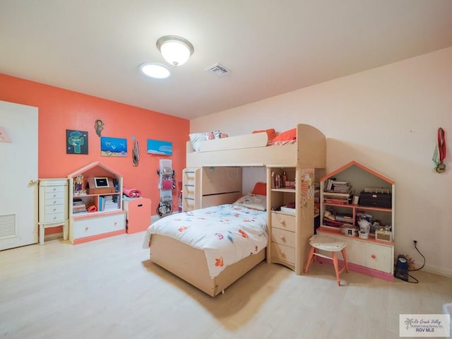 bedroom featuring hardwood / wood-style floors